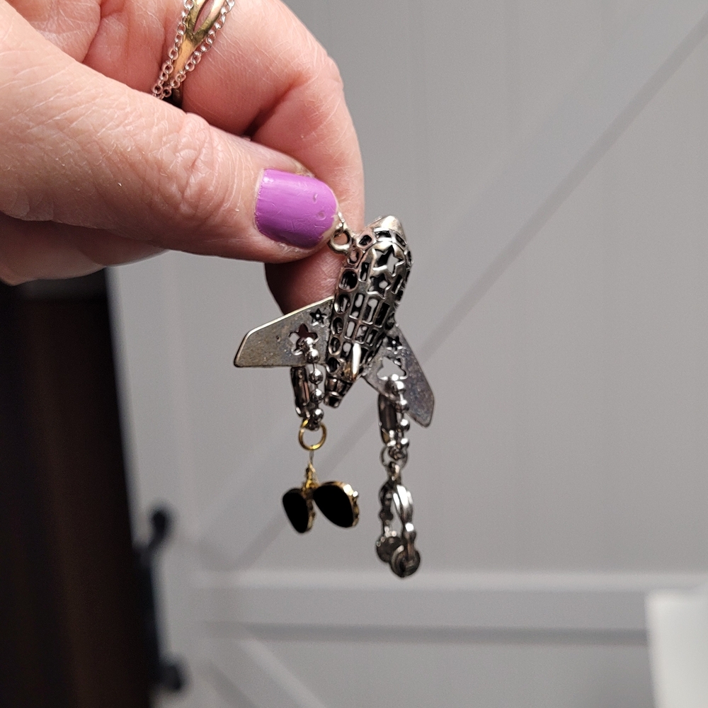 Hand Crafted Silver and Black Airplane Necklace with Charm Accents